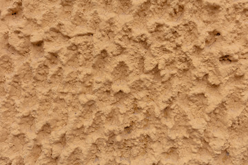YELLOW PAINT WALL WITH CEMENT ROUGH SURFACE, BACKGROUND