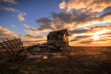 Old abandoned barn in midwest during sunset