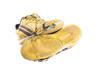 old dirty yellow  football shoes damaged on white background football  object isolated