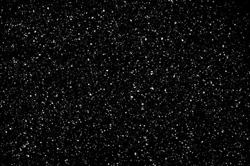 Chaotic white star bokeh on a isolated black background. falling blurry bokeh snow overlay, starry sky. white spots on black background, white drops and spots. abstraction.