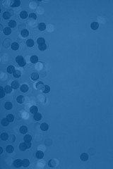 Creative pastel fantasy holiday card with party confetti in classic blue. Baby shower, birthday, celebration concept. Vertical