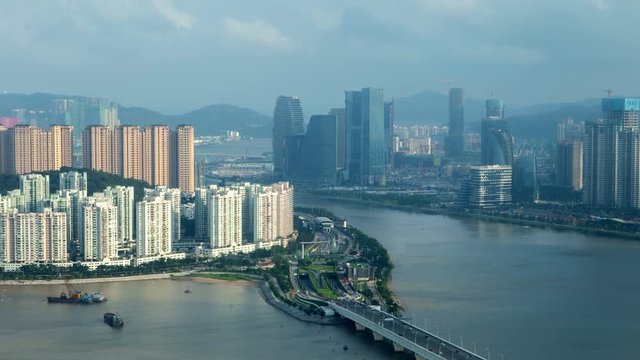 Macau &ndash; Zhuhai border earial cityscape day timelapse pan up