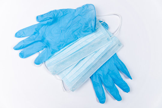 Medical Mask And The Latex Gloves On A White Background