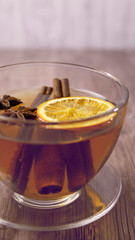 A warm cup of tea with orange and  anise ,herbal tee