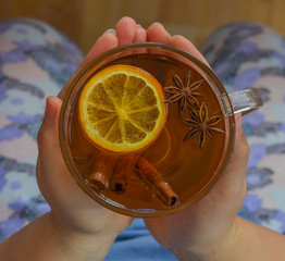A warm cup of tea with orange and  anise ,herbal tee