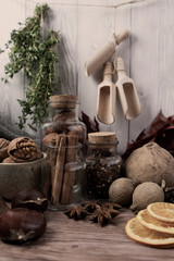 Obraz na płótnie Canvas Winter autumn different ingredients for a warming hot tea white wood background, copy space, top view