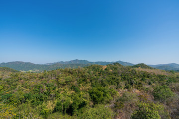 Fototapeta na wymiar beautiful blue sky high peak mountains mist fog wildlife green forest at Phu Khao Hin Pakarang, Khao Koh, Phetchabun, Thailand. guiding idea long weekend for backpacker camping hiking 