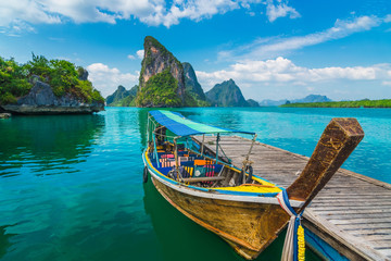 Beautiful nature scenic landscape Phang-Nga bay with wooden boat moored on pier waiting traveler, Water travel adventure Phuket Thailand, Tourism destination scenery Asia, Summer holiday vacation trip