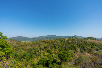 Fototapeta na wymiar beautiful blue sky high peak mountains mist fog wildlife green forest at Phu Khao Hin Pakarang, Khao Koh, Phetchabun, Thailand. guiding idea long weekend for backpacker camping hiking 