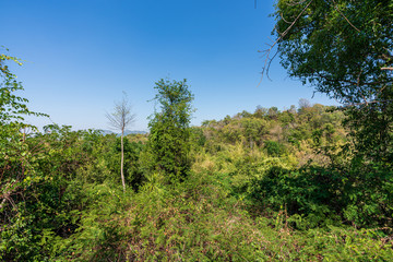 beautiful blue sky high peak mountains mist fog wildlife green forest at Phu Khao Hin Pakarang,  Khao Koh, Phetchabun, Thailand. guiding idea long weekend for backpacker camping hiking  