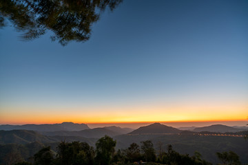 beautiful blue sky high peak mountains mist fog wildlife green forest at Khao Koh, Phu Tub Berk, Phetchabun, Thailand  guiding idea long weekend for backpacker camping campfire relaxing hiking