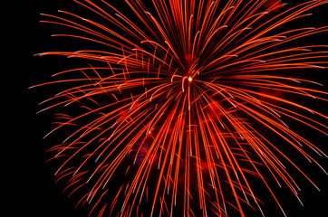 Bright festive fireworks against the night sky. Firework Fiery flowers during the holiday.