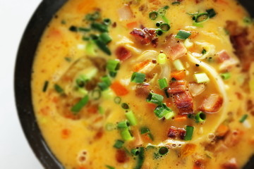 Chopped cabbage, carrot, spring onion, bacon in egg wash