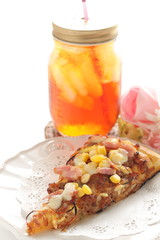 Italian food, piece of bacon and corn pizza on dish