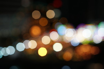 defocused bokeh lights on the night. Blurred lighting in the city with can be for backdrop, background and template.
