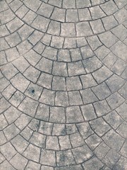 pavement of cobblestones.Classic gray color of brick background . Close up. Surface texture.