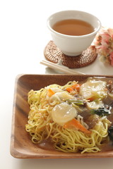 Chinese food, stir fried vegetarian and scallop on pan fried ramen noodles 