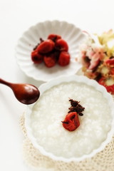 Japanese food, marinated plum Umeboshi and rice porridge