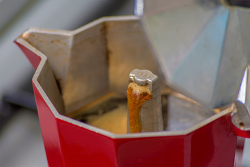 Making black moka coffee using moka coffee maker close-up