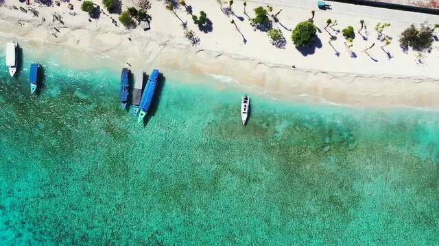 Sailboats near tropical island beach, Bora Borra, French Polynesia