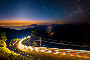 Doi Inthanon National park before the sunrise and light trail from cars at Chiang Mai Province, Thailand