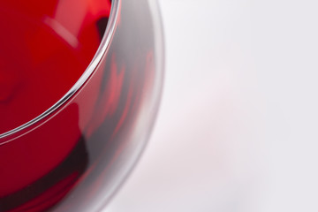 Red wine in glass, viewed from the top corner. There is a place for text.