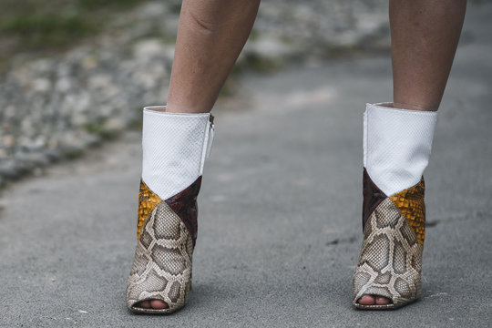 Milan, Italy - February 23, 2019: Street style – Boots detail after a fashion show during Milan Fashion Week - MFWFW19