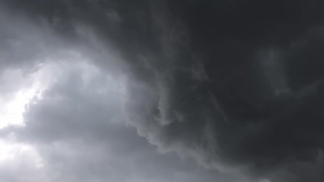 Dark scary rolling clouds with lightning flashes. A stormy morning in South Africa, Limpopo. Time-lapse