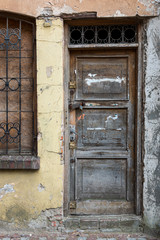 Old devastated wooden front door