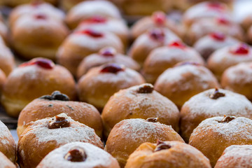 Hanukkah donuts (sufgania) are delicious and sweet in honor of Chanukah (the winter Jewish holiday in memory of miracles and wonders). Filled with strawberry jam or milk jam and deep-fried.