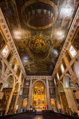 Fototapeta na wymiar Ornate interior of the Roman Catholic church Igreja de Sao Roque (Church of Saint Roch) looking towards the main altar. Lisbon, Portugal.