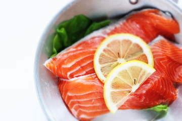 Freshness salmon and lemon on stainless steel pan