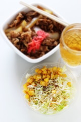 Corn and cabbage with sesame dressing in plastic lunch box