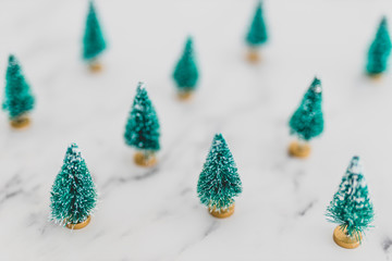 festive season's decorations group of miniature Christmas trees shot at shallow depth of field