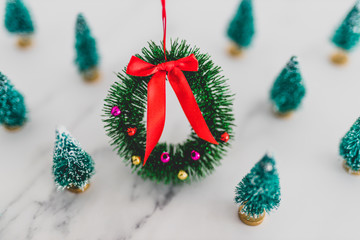 festive season's decorations group of miniature Christmas trees with wreath