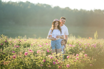 Fototapeta premium Family couple of togetherness in a field of flowers