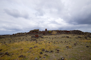 Fototapeta na wymiar A toppled moai along the southern coast of Easter Island, Chile