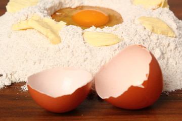 Pile of flour, egg and butter. Making Christmas Gingerbread Cookies