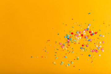 yellow background with multicolored sprincle
