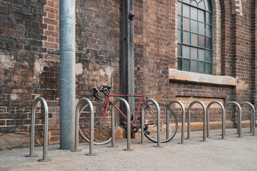 Fototapeta na wymiar Bicycle parked on a brick wall