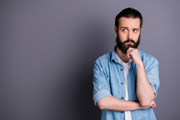 Portrait of minded puzzled focused guy freelancer look copyspace touch chin hands think thoughts invent work ideas wear modern outfit isolated over grey color background