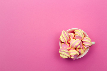 pink festive birthday background congratulations with sweet marshmallows sweets