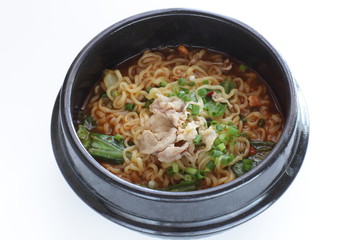 Pork and Korean spicy ramen noodles in traditional clay pot