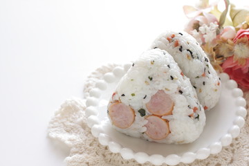 Japanese food, sausage and rice ball on dish