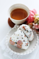 Japanese food, sausage and rice ball on dish