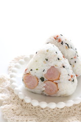 Japanese food, sausage and rice ball on dish