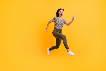 Fototapeta na wymiar Full size profile side photo of funny sportive girl jump run practice sport jogging on spring holidays free time wear modern outfit isolated over shine color background