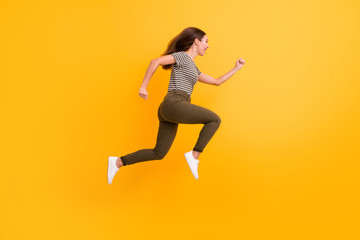 Fototapeta na wymiar Full length profile side photo of funky funny crazy girl jump run after black friday bargains wear good looking clothes isolated over shine color background