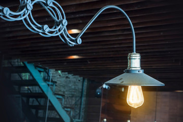 Fototapeta na wymiar Decorative antique style light bulbs against black background