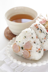 Japanese food, sausage and rice ball on dish